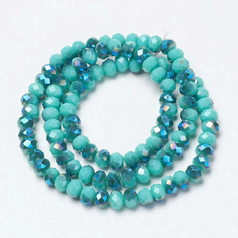 Facetterade glaspärlor - Opak Teal blue med blåttlyster, 4x3mm 1 sträng
