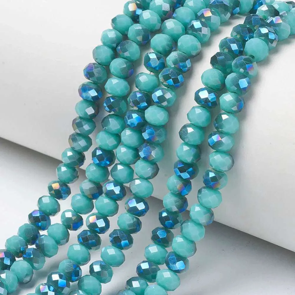 Facetterade glaspärlor - Opak Teal blue med blåttlyster, 4x3mm 1 sträng