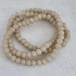 Facetterade glaspärlor - Matte champagne med lyster, 6x4mm 1 sträng